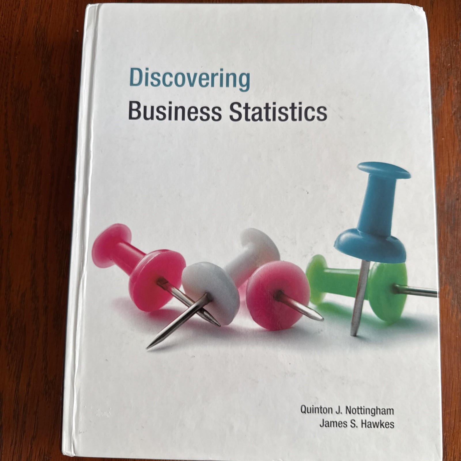 Discovering Business Statistics Textbook – Hardcover – GOOD